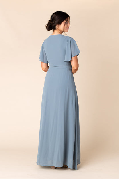 Back view of dusty blue chiffon maxi bridesmaid dress